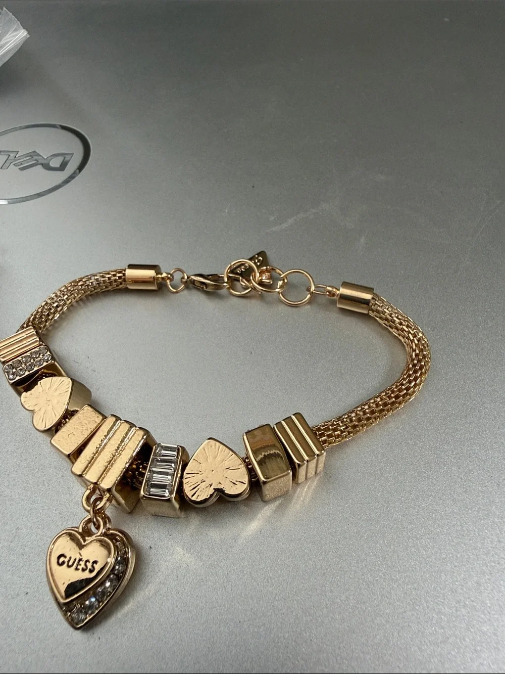 Gold color Guess mesh. Charm bracelet 8”.   NWOT.  Beautiful